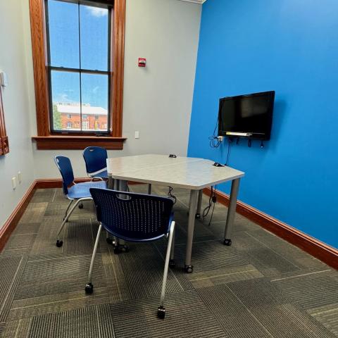 Meeting Room with chairs, moveable tables, TV and window