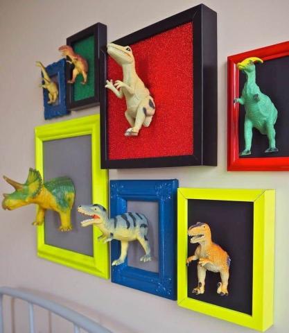 Dinosaurs in frames on a wall