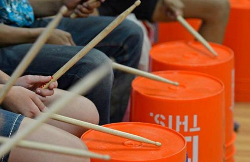 Children drumming buckets