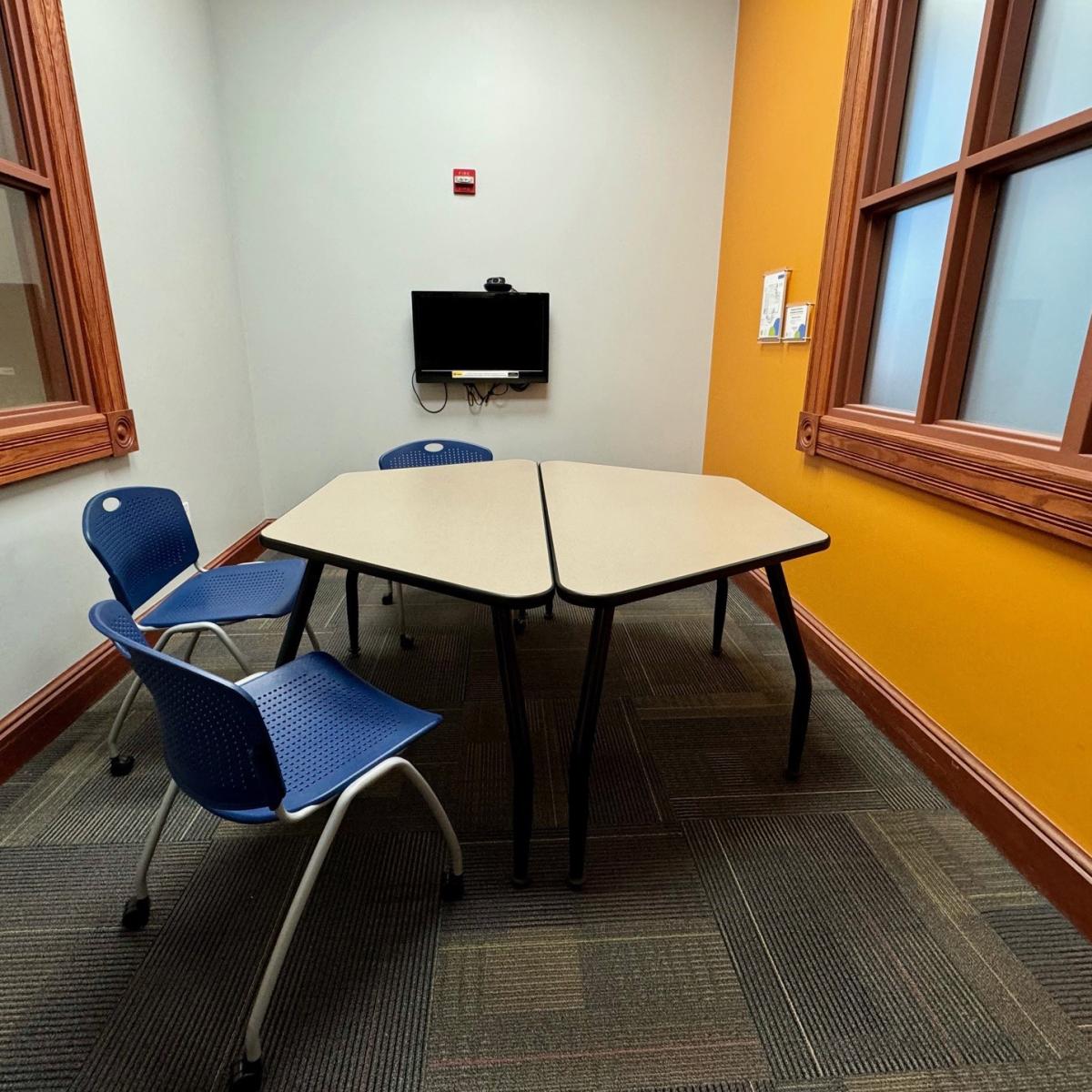 Meeting Room with chairs, moveable tables and TV