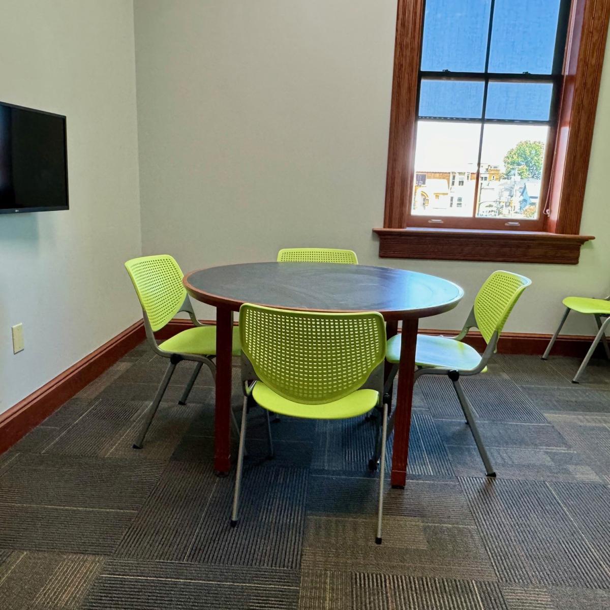 Meeting Room with chairs, moveable tables, TV and window