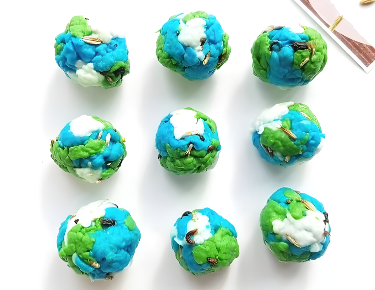 colorful blue, green, and white seed bombs that look like small planet Earths